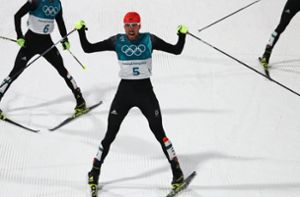 Der Nordische Kombinierer Johannes Rydzek (Mitte) holte bei den Olympischen Winterspielen 2018 in Pyeongchang Gold für Deutschland. Foto: dpa/Daniel Karmann