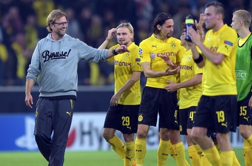 Ein zufriedenes Dortmunder Team nach dem 2:0-Sieg in der Champions League über den FC Arsenal. Foto: dpa