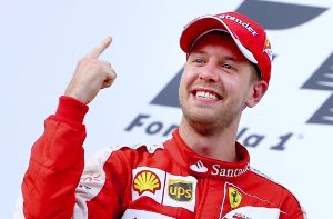 Der sichtlich gerührte Sebastian Vettel ist nach seinem Sieg mit Ferrari beim Großen Preis von Malaysia im Freudentaumel. Foto: EPA
