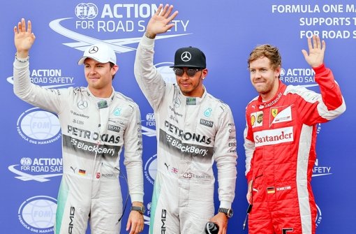 Mercedes-Pilot Lewis Hamilton (Mitte) hat sich die Pole Position beim Großen Preis von Monaco vor seinem Teamkollegen Nico Rosberg (links) und Ferrari-Pilot Sebastian Vettel gesichert. Foto: EPA