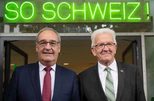 Der Schweizer Bundespräsident Guy Parmelin mit Winfried Kretschmann. Foto: dpa/Marijan Murat