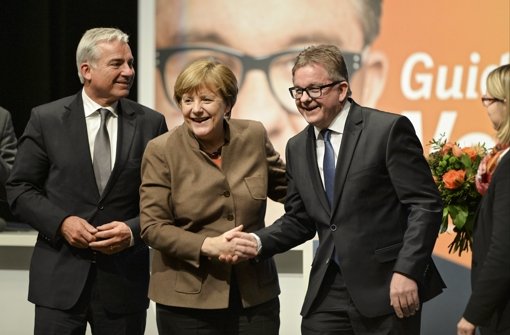 Bundeskanzlerin Angela Merkel mit Südwest-CDU-Spitzenkandidat Guido Wolf (rechts) und dem Landesvorsitzenden Thomas Strobl. Foto: dpa