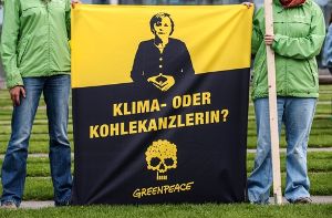 Greenpeace mit einer Protestaktion in Berlin. Foto: dpa