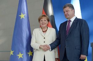 Petro Poroschenko trifft mit Angela Merkel zusammen. Foto: dpa
