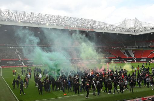 Hunderte United-Fans stürmten das Stadion. Foto: AFP/OLI SCARFF