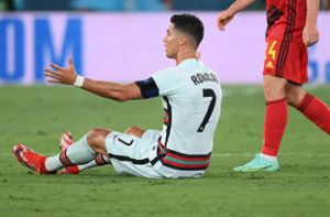 Für Cristiano Ronaldo und sein Team hat es nicht gereicht: Portugal verliert im EM-Achtelfinale mit 0:1 gegen Belgien. Foto: AFP/LLUIS GENE