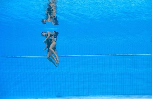 Bei der Schwimm-WM ist es zu dramatischen Szenen gekommen. Foto: AFP/OLI SCARFF