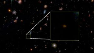 Das Falschfarbenbild des „James Webb“-Weltraumteleskops zeigt die Galaxie Jades-GS-Z7-01-QU (im Quadrat markiert als schwach leuchtender Punkt). Foto: Jaddes  Collaboration/dpa