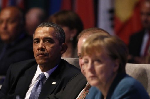 Bundeskanzlerin Angela Merkel mit dem US-Präsidenten Barack Obama beim Nukleargipfel in Den Haag. Foto: REUTERS POOL / dpa