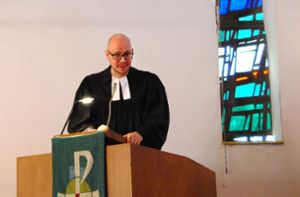 Pfarrer Christian Schmitt auf dem Podium Foto: René Wolff